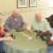 Louis Bicocchi, Louis Nicolosi, Dennis Pauley and Charles Kelly enjoy a friendly game of Dominoes.