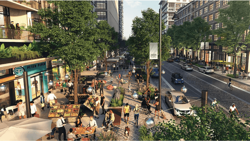 bustling downtown city street with outdoor patios and pedestrians 