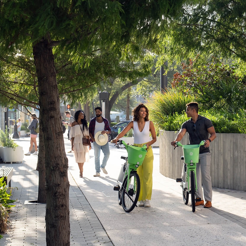 cyclists walking their bikes 