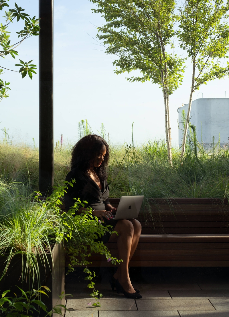 woman working outside on her laptop 