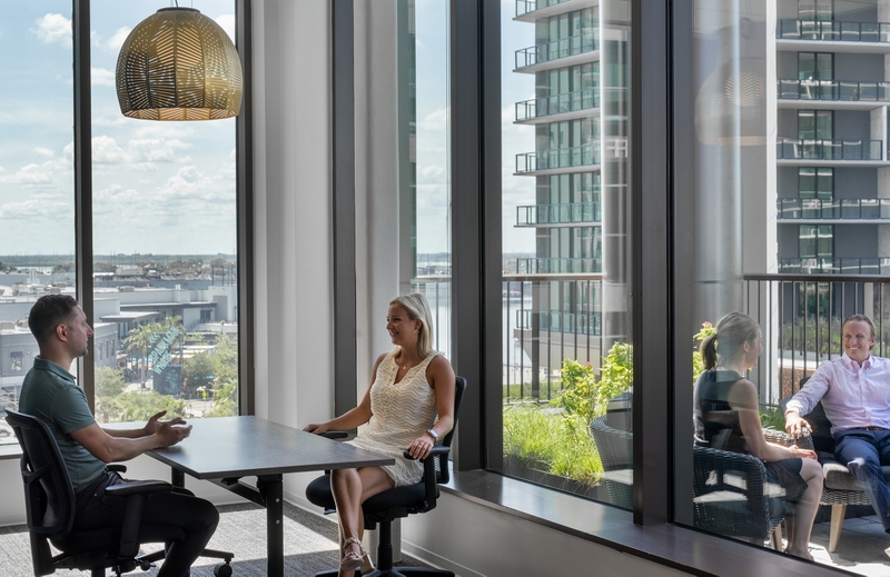 coworkers talking at tables