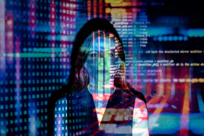 A person superimposed over code