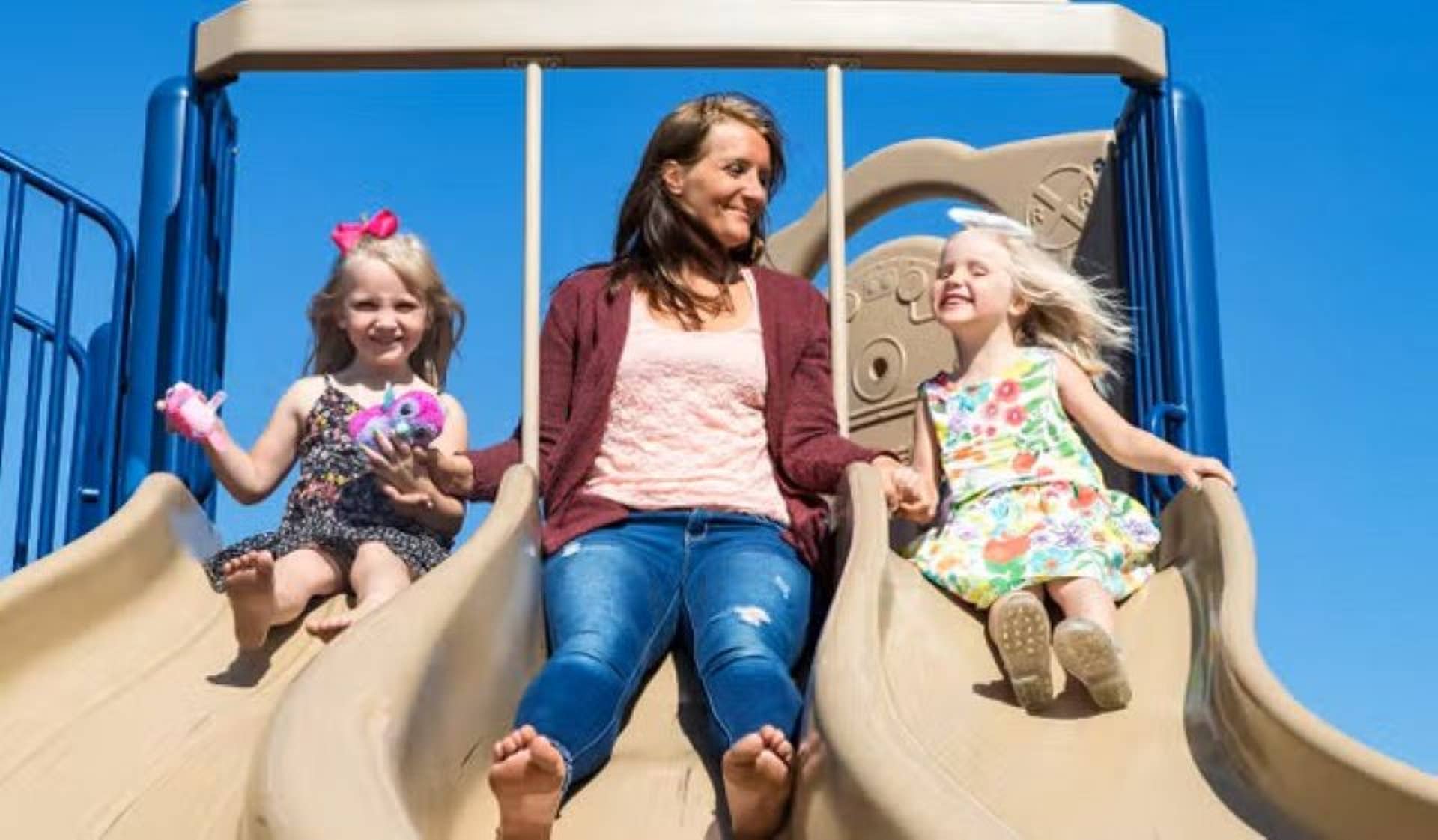Mom and 2 kids on slide