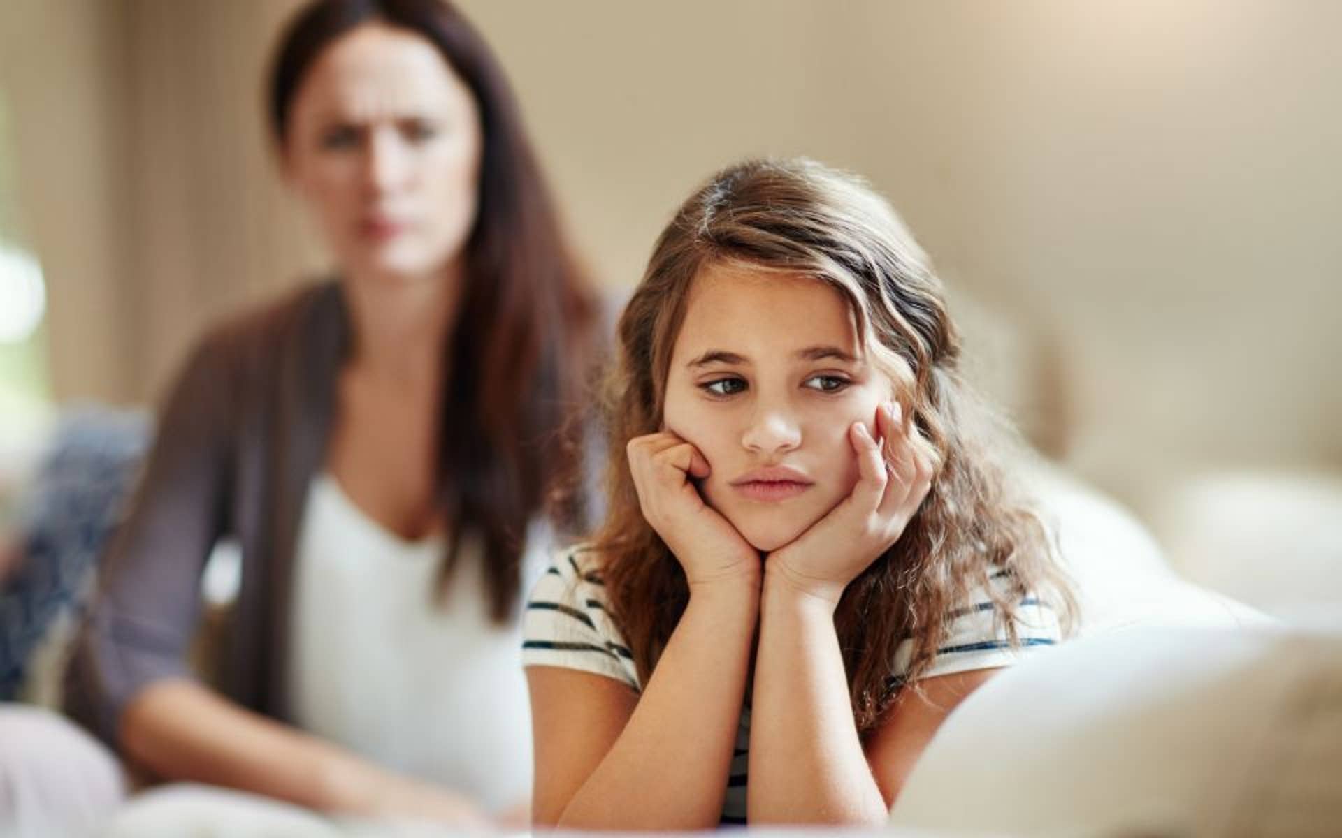 Mother looking at daughter from behind