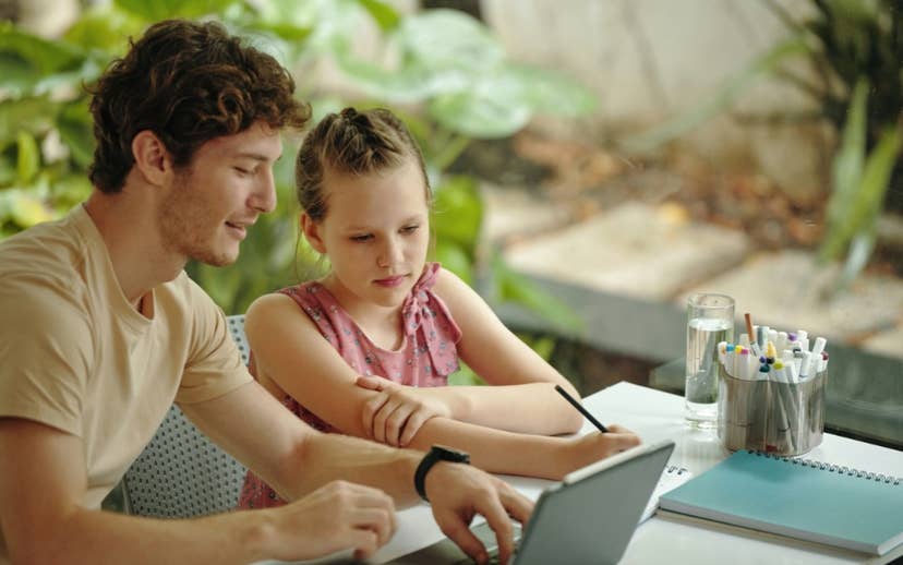 Father and Daughter in front of laptop screen