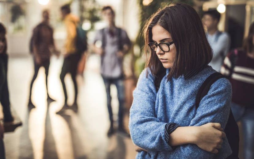 Teen Girl in School Hallway