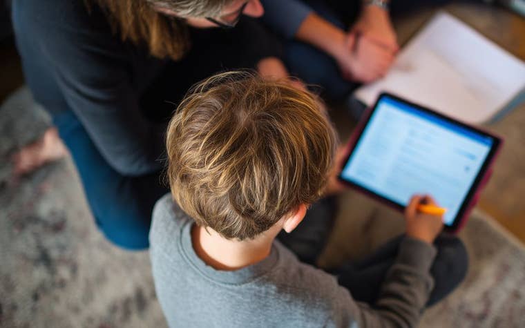 Mom-son-working-on-homework-with-AI