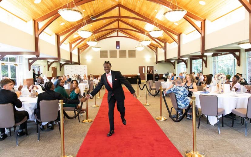 youth walking down red carpet at awards ceremony