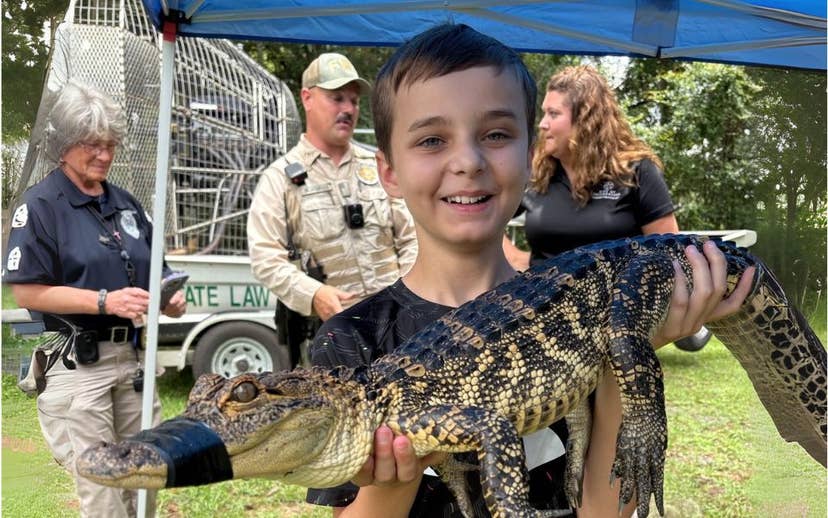 Boys Holding small alligator at career fair