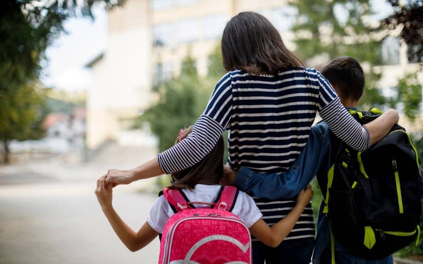 Mom walking kids to school