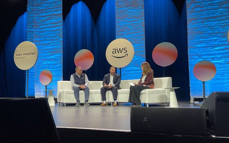 Oscar Gonzalez, Director of the Boys Town National Hotline talking on stage at AWS Imagine Conference