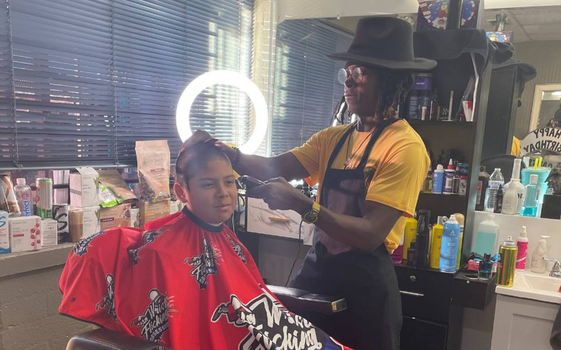 Youth getting haircut 