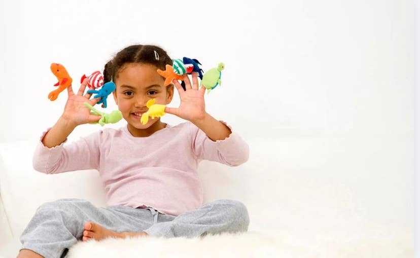 Young girl with finger puppets