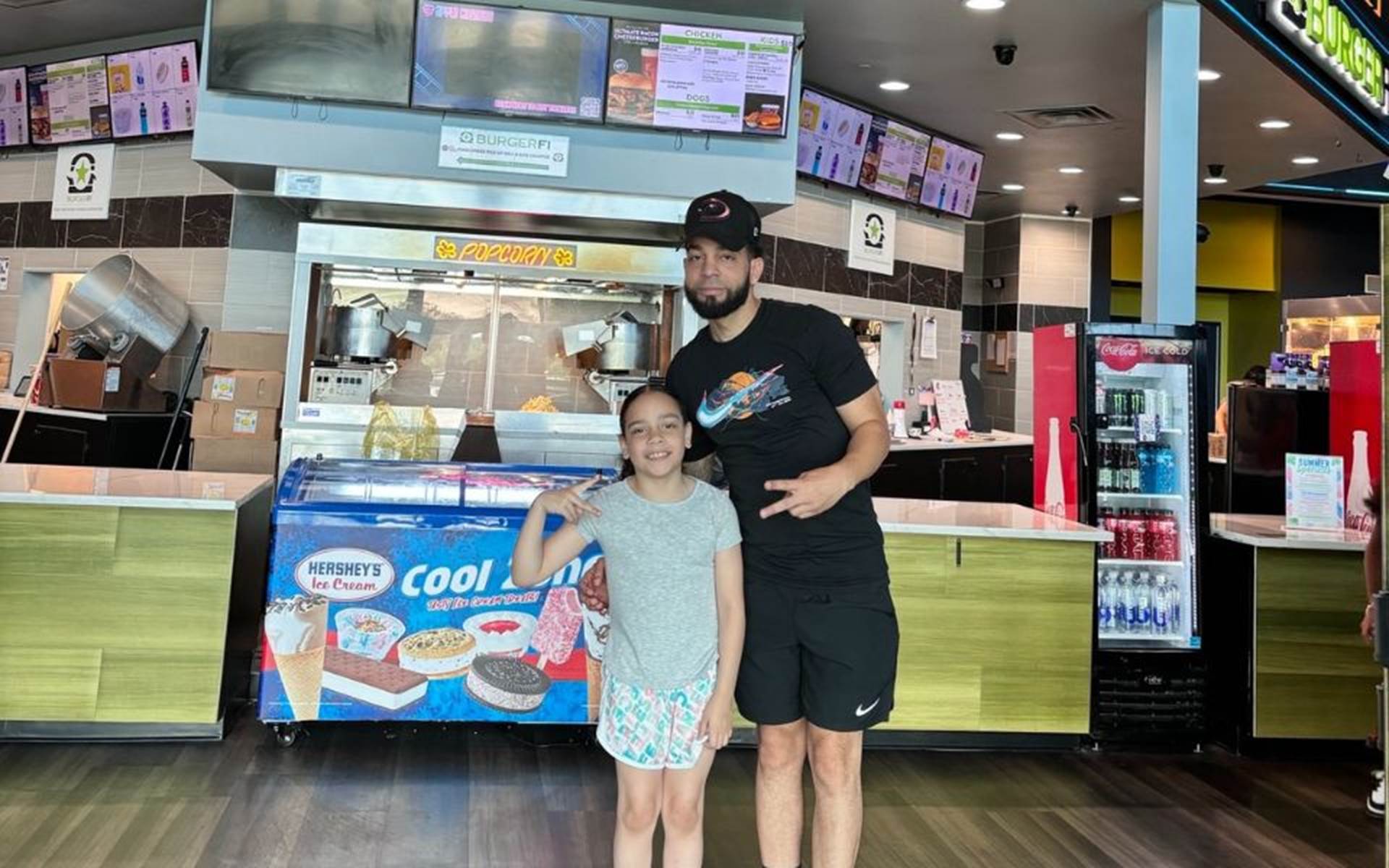 Father and Daughter at Concession stand 