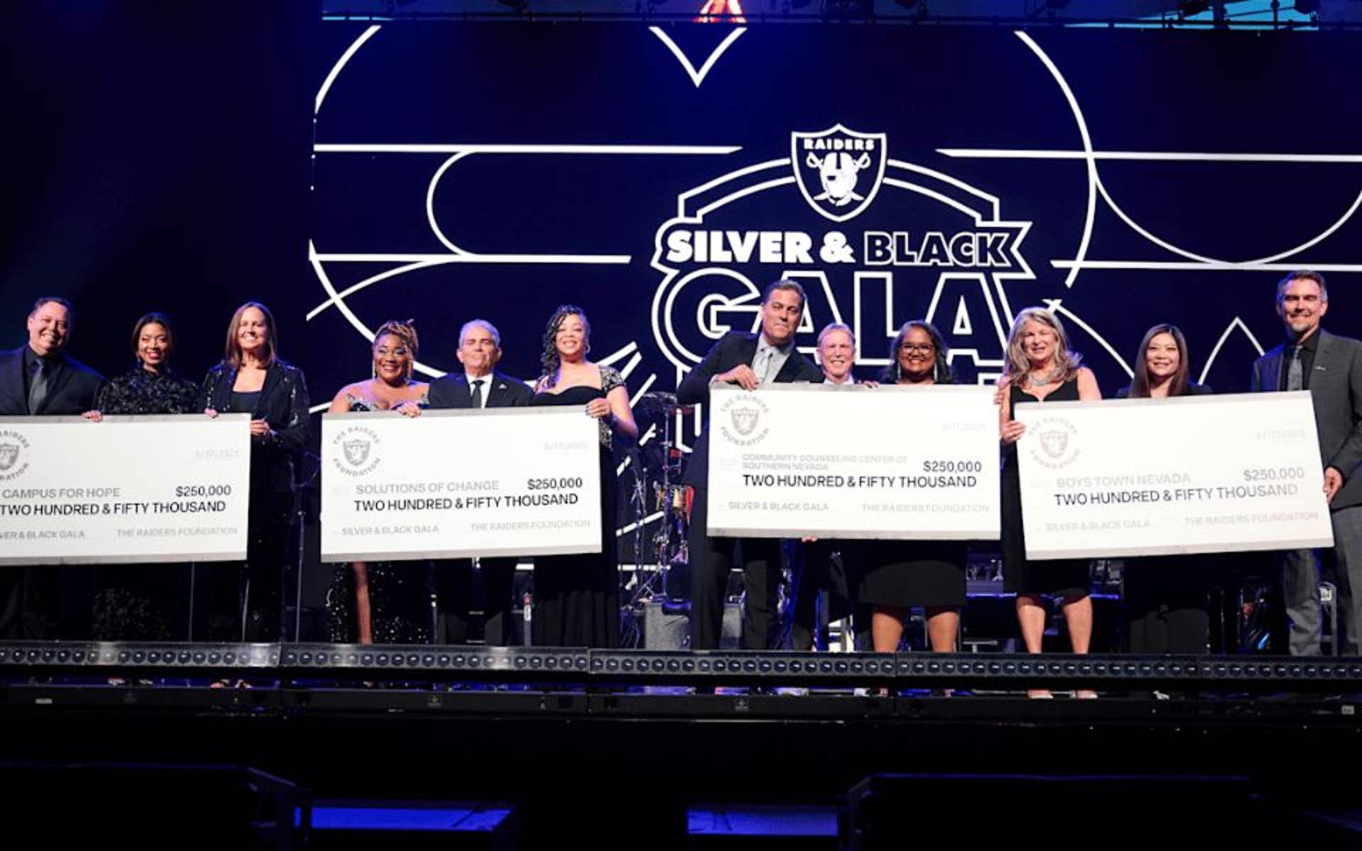 Boys Town Nevada accepting donation from Raiders 
