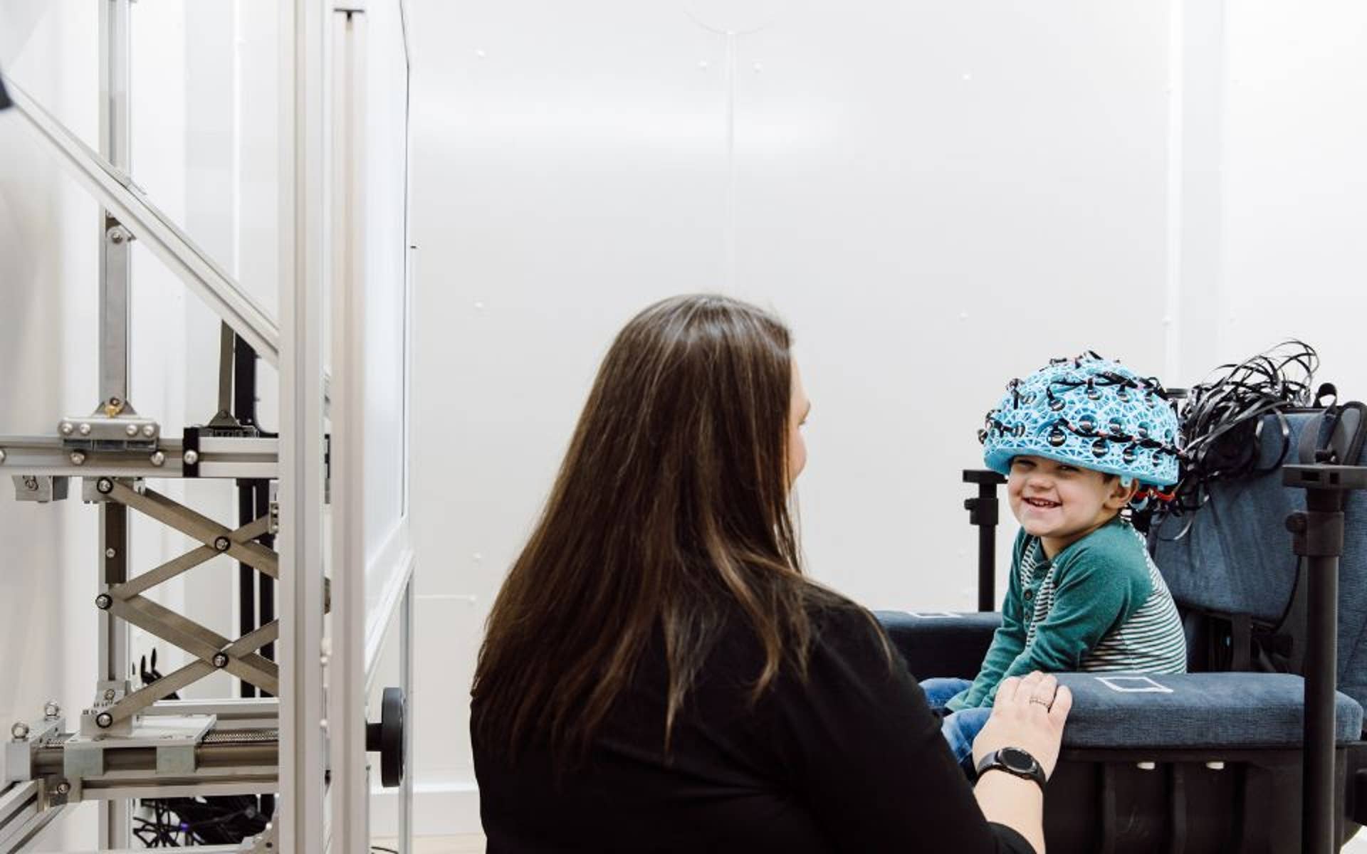 Boys Town Research Hospital doctor talking with young boy 