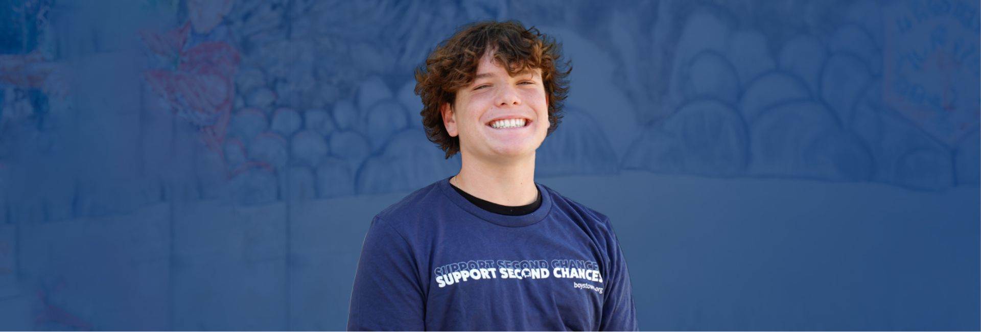 Boys Town kid wearing Support Second Chances shirt