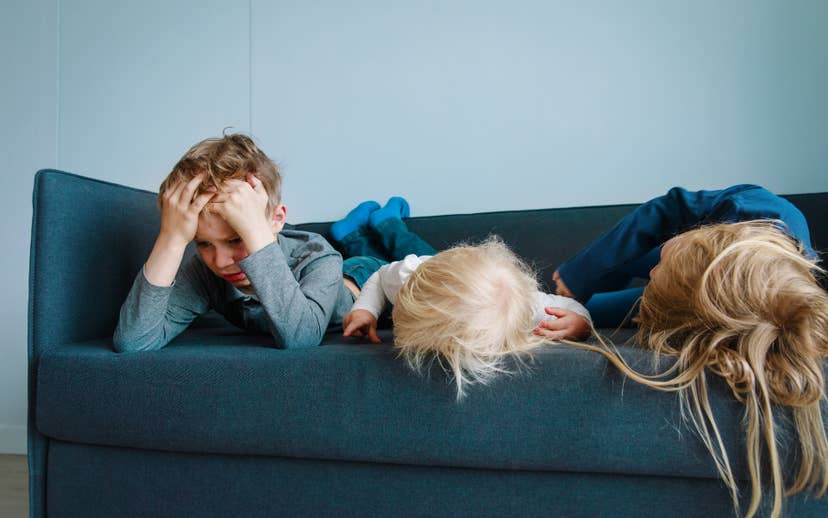 Youth on couch having a meltdown