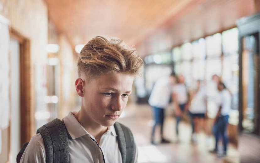 Teen Boy Wearing a Backpack looking concerned