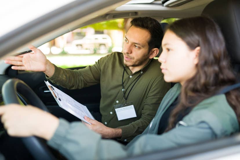Teen driver with driving instructor