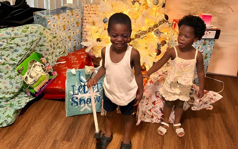 young boy and girl with Christmas gifts