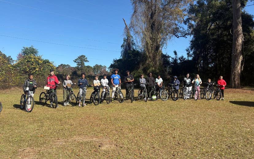 Youth on Bikes in Field
