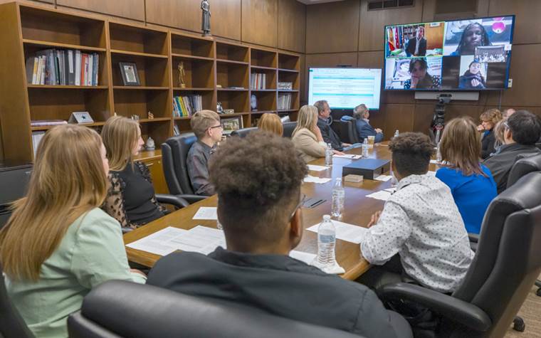 Students and Staff attending meeting