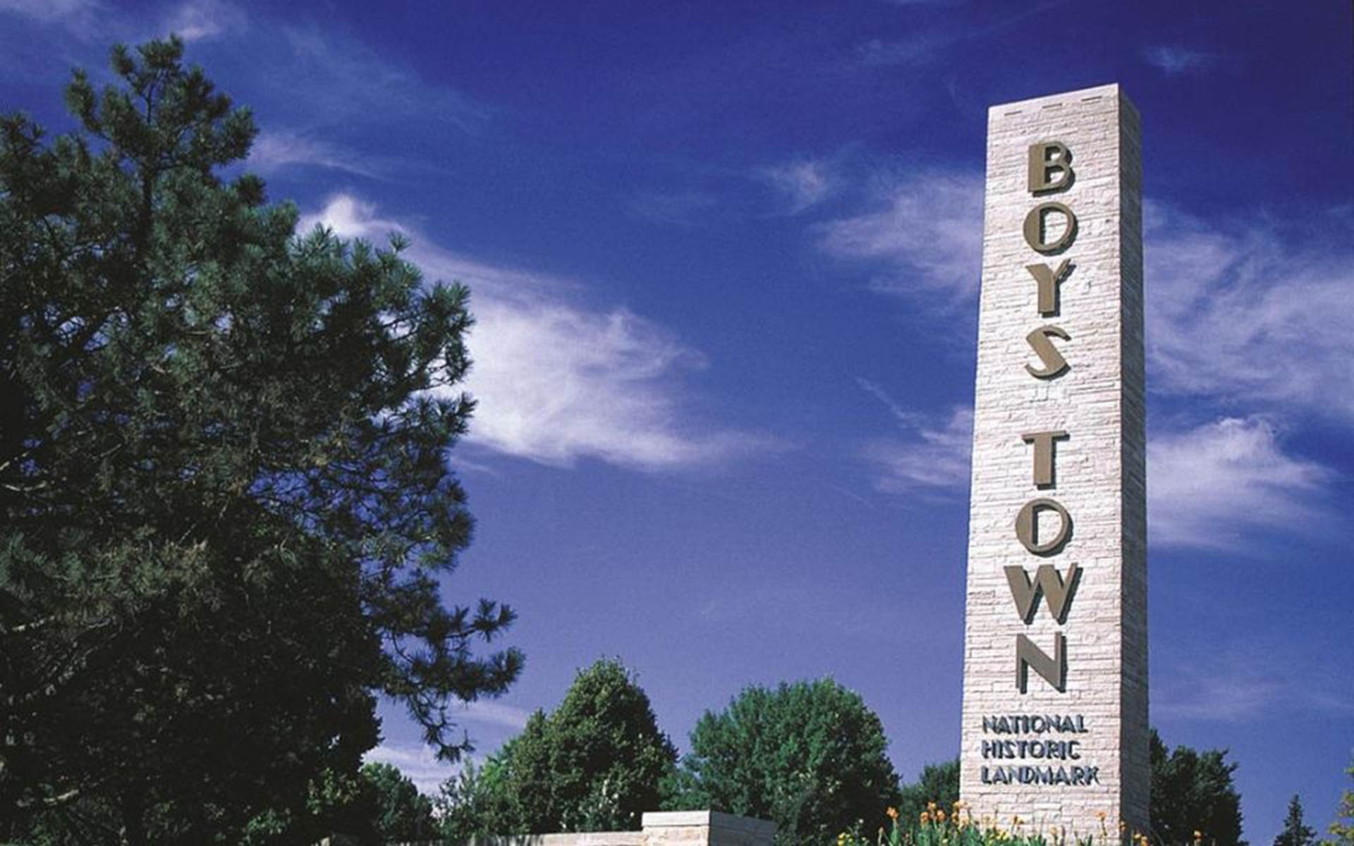 Boys Town landmark green trees and blue sky