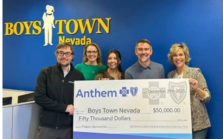 Jon Etzel and company holding the Anthem Medicaid $50k check