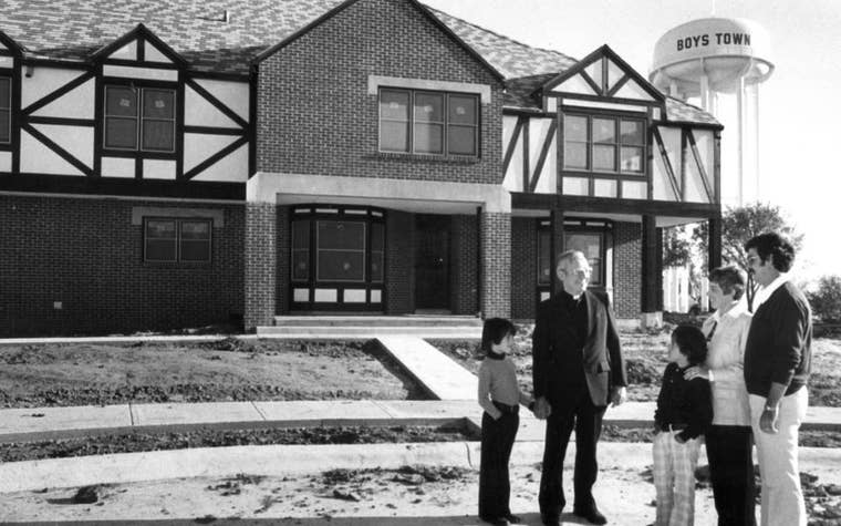 Black and White photo of a family on Boys Town Campus