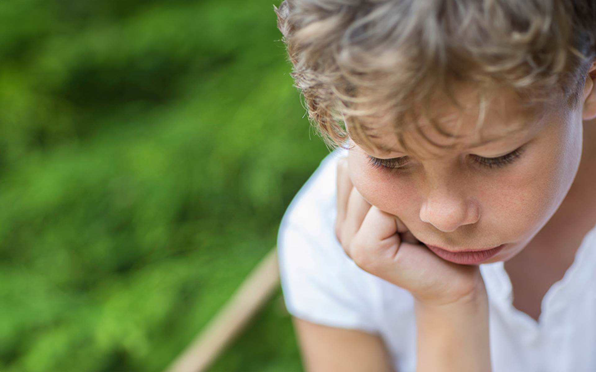 Young child contemplating