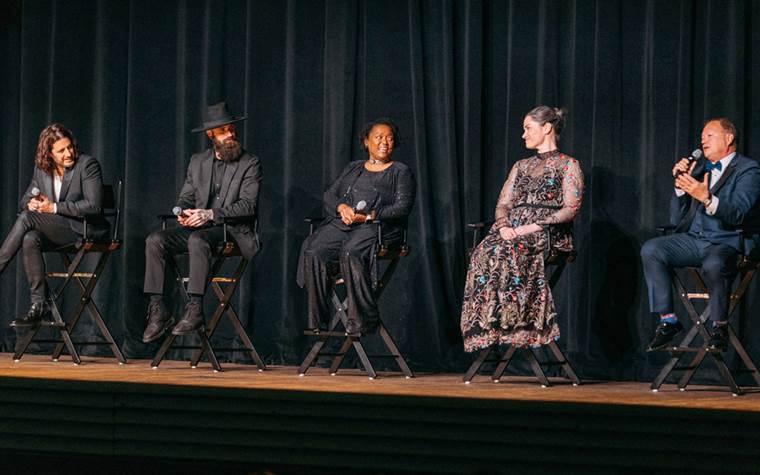 Actors and crew on stage