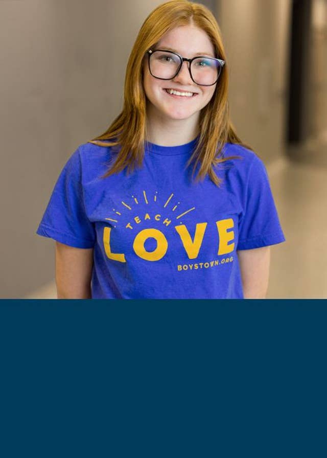 Girl wearing Teach Love T-Shirt