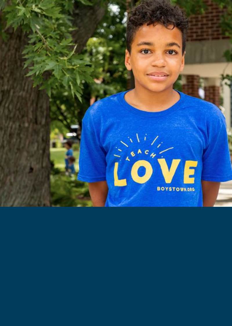 boy in teach love shirt