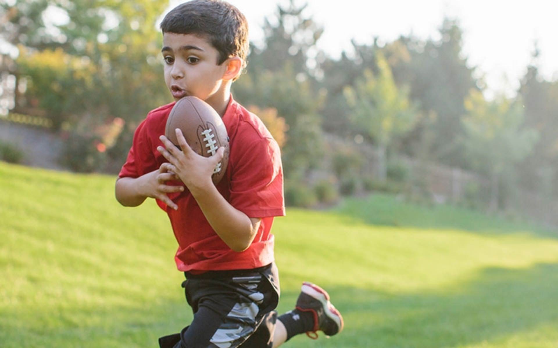 Kid playing football