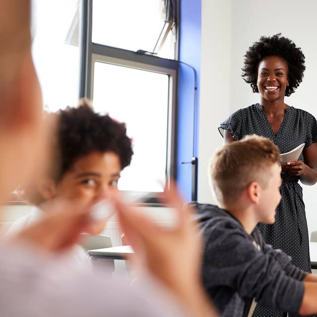 Teacher working with students