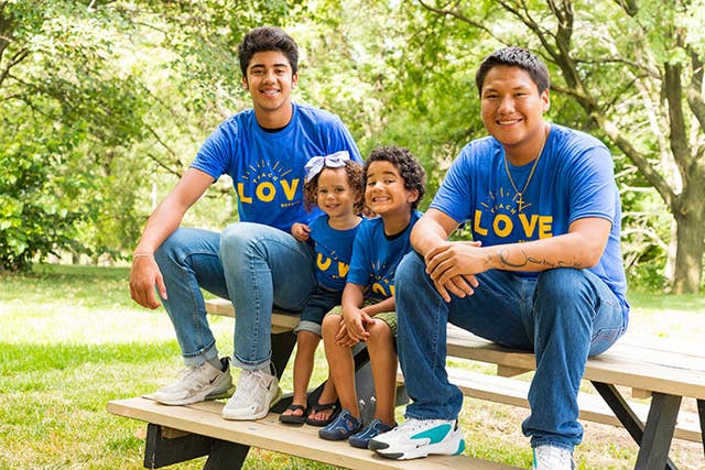 Boys Town kids sitting on a park bench