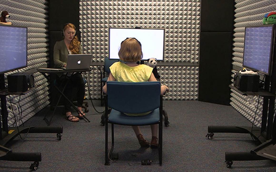 Young girl taking hearing test