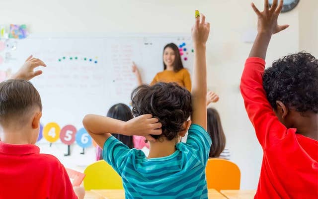 Kids raising their hands