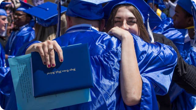 Graduates hugging