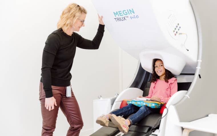 Child having their head scanned