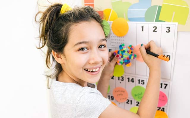 Girl finding event on a calendar 