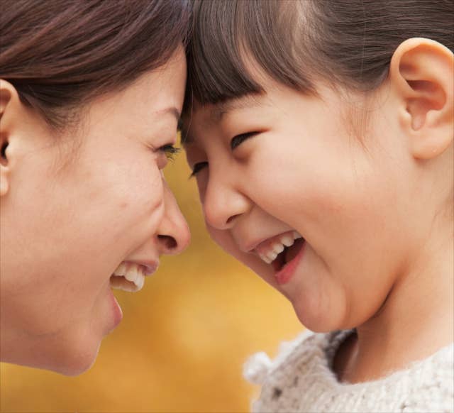 Mother and child laughing together