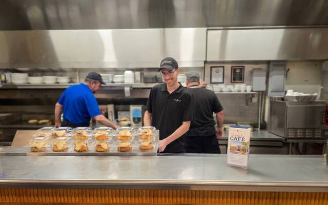 Employee Posing in Kitchen