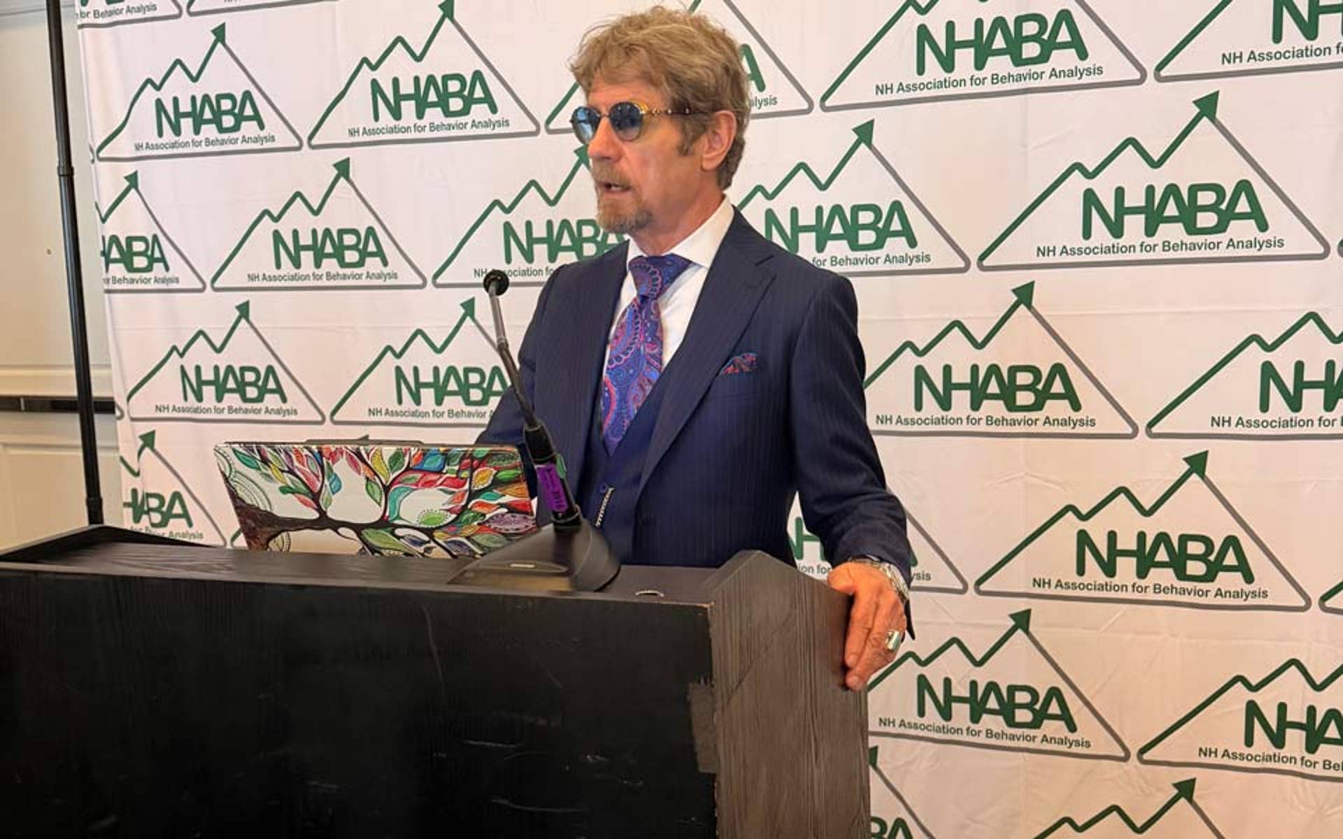 Dr. Friman speaking at podium for NHABA