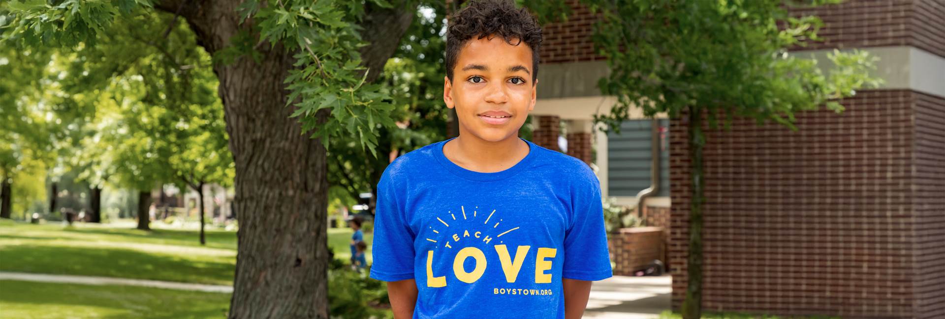 boy in teach love shirt