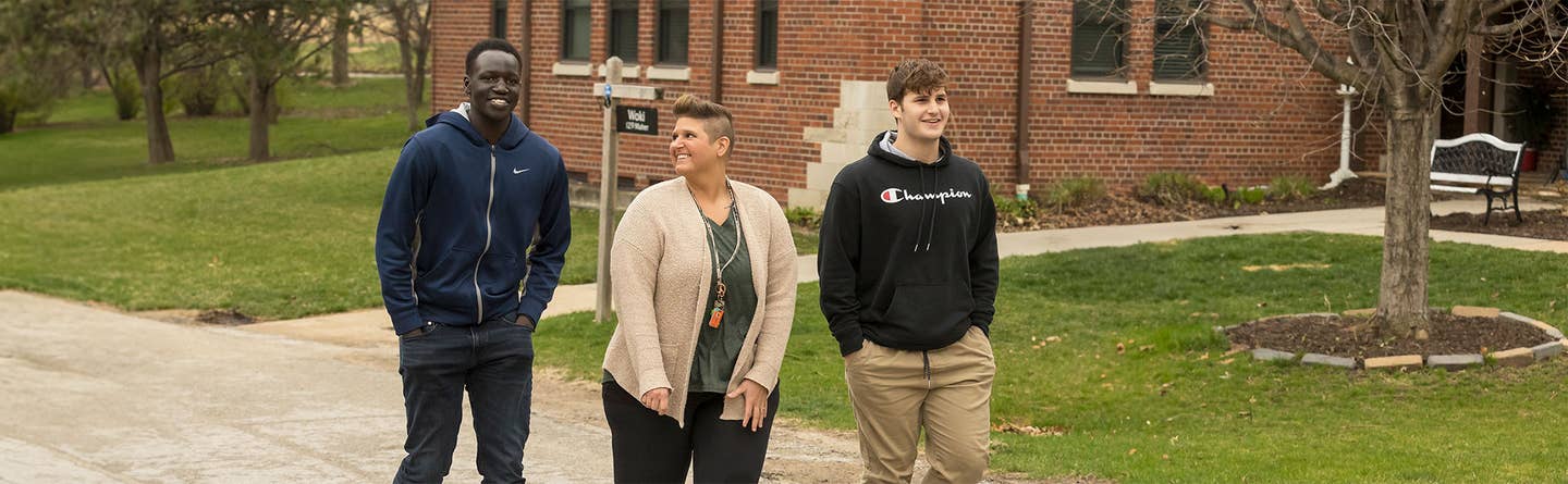 Kids walking in front of boys town house