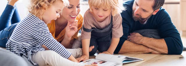 Mother and Father reading to their kids