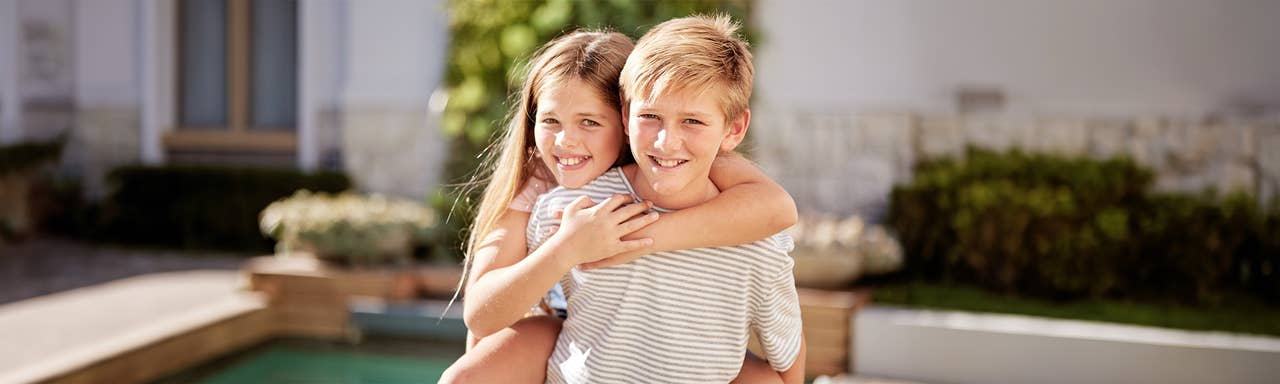 Boy and Girl recreating the he aint heavy pose