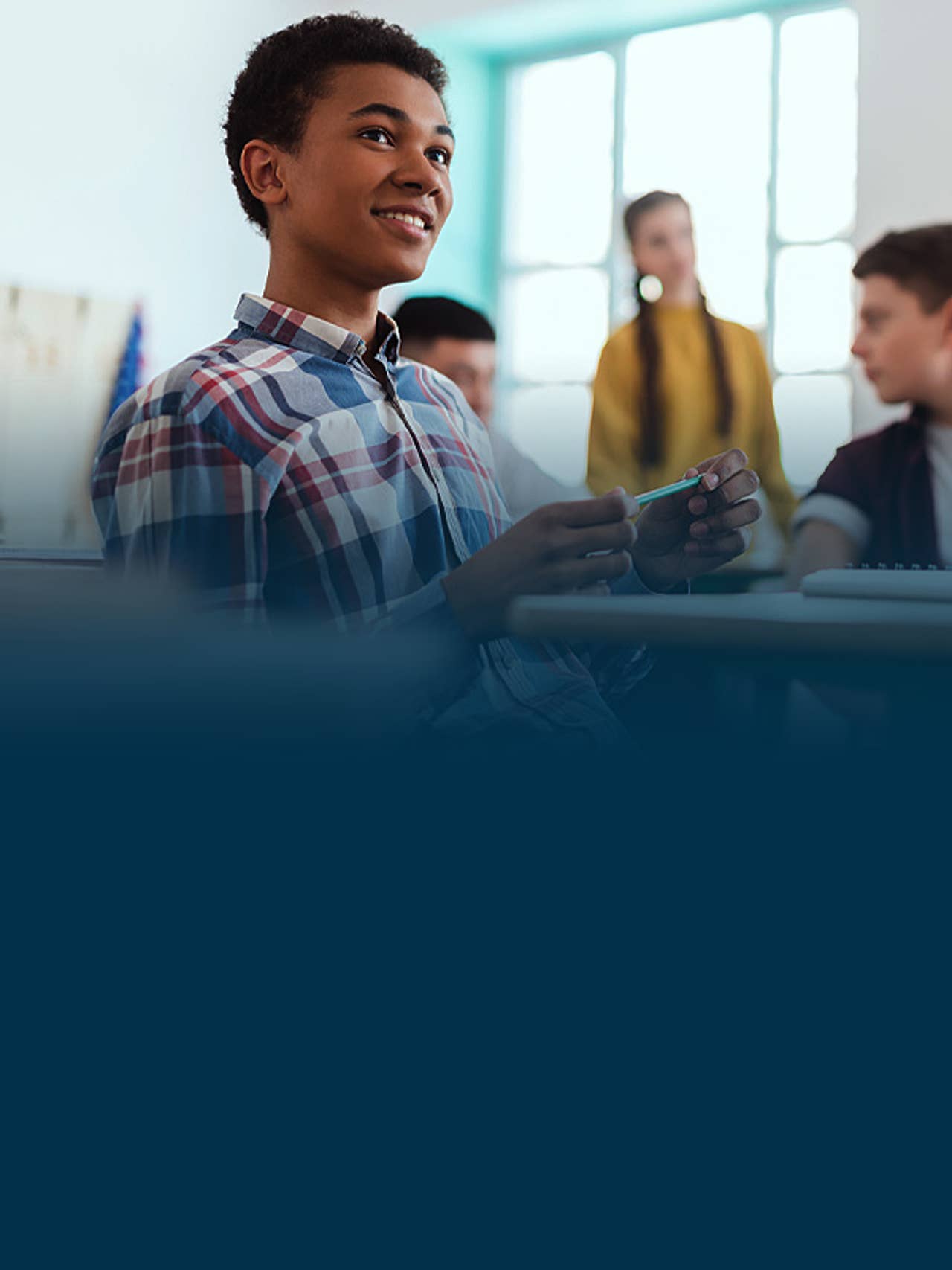 Young student smiling in a classroom